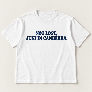 Not lost, just in Canberra slogan tee, white Core Tee, navy serif print